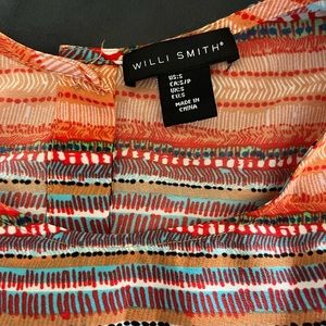 Sleeveless button-back blouse. Aztec, doodle, vibrant multi-color design.